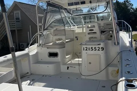 Slide: The Image of 2008 Boston Whaler 305 Conquest boat interior with seating and control panel. - 3