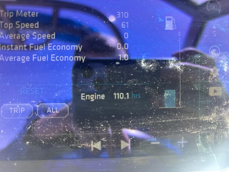 Slide: The Image of Dashboard display of a 2017 Chaparral 264 Sunesta Surf showing trip and engine hours. - 17