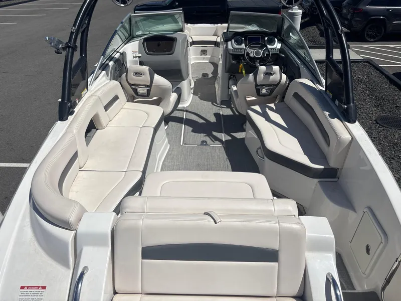 Slide: The Image of 2017 Chaparral 264 Sunesta Surf boat interior with spacious seating and modern dashboard. - 6