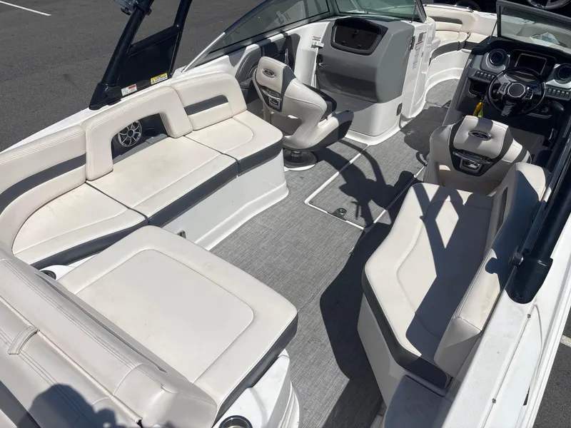 Slide: The Image of 2017 Chaparral 264 Sunesta Surf boat interior with spacious seating and modern dashboard. - 7