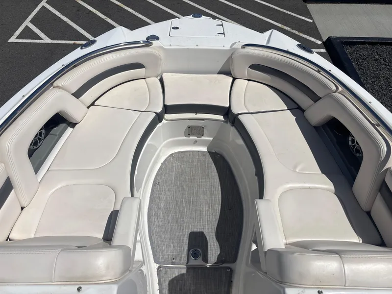 Slide: The Image of 2017 Chaparral 264 Sunesta Surf boat with spacious white seating area. - 8