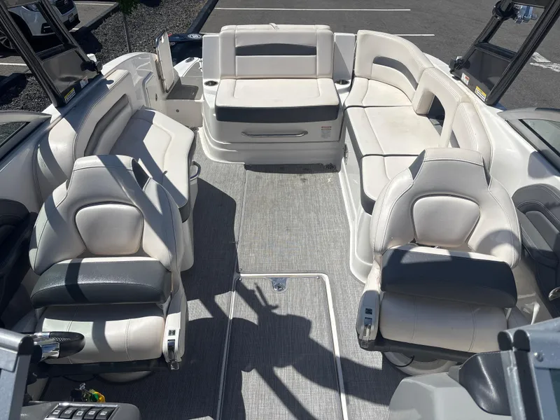 Slide: The Image of 2017 Chaparral 264 Sunesta Surf boat interior with spacious seating and modern design. - 9
