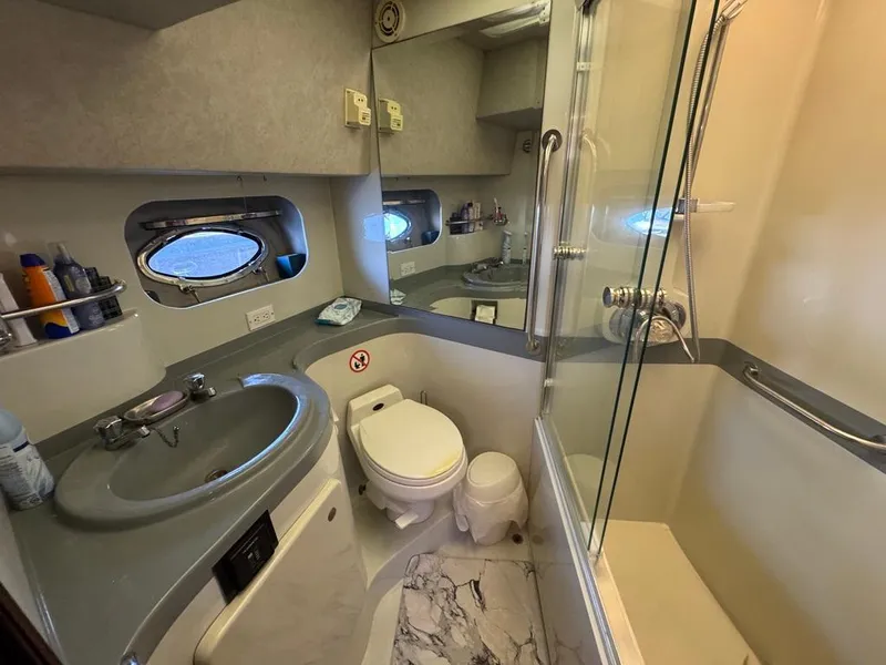 Slide: The Image of Bathroom interior of 1989 Birchwood 62 Cockpit Motor Yacht with shower and sink. - 36