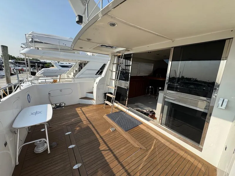 Slide: The Image of Birchwood 62 Cockpit Motor Yacht 1989, featuring spacious deck and modern interior. - 6