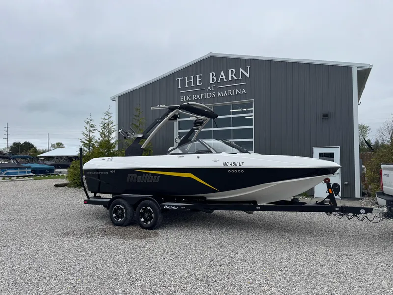 Slide: The Image of 2018 Malibu VLX boat on trailer at Elk Rapids Marina. - 1