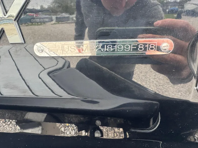 Slide: The Image of 2018 Malibu VLX boat with visible identification number plate. - 15