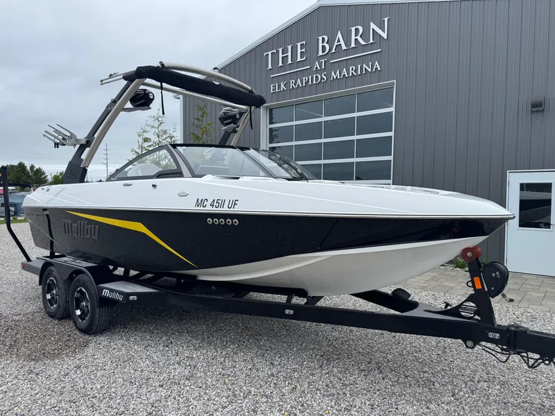 Slide: The Image of 2018 Malibu VLX boat on trailer at Elk Rapids Marina. - 2