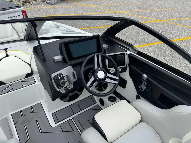 Slide: The Image of 2018 Malibu VLX boat interior with modern dashboard and steering wheel. - 9