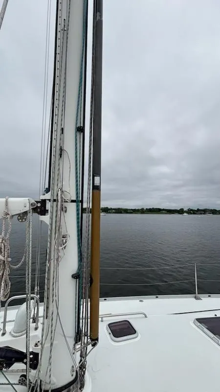 Slide: The Image of Sailboat deck view of 2003 J Boats J/46 under cloudy skies. - 13