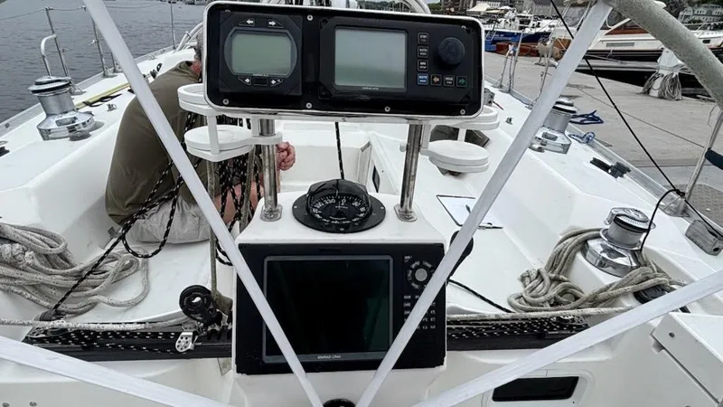 Slide: The Image of 2003 J Boats J/46 cockpit with navigation instruments and ropes. - 24