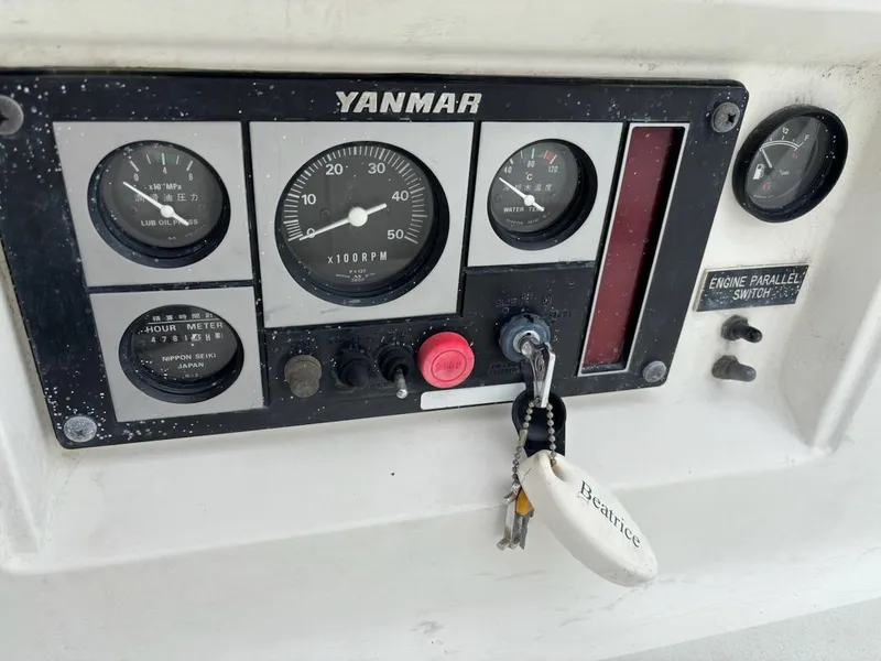 Slide: The Image of Control panel of a 2003 J Boats J/46 with Yanmar engine gauges and key. - 25