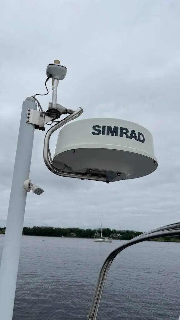 Slide: The Image of Simrad radar on 2003 J Boats J/46 sailboat, overcast sky, calm water. - 26