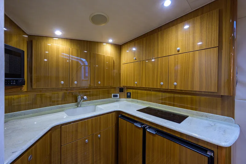 Slide: The Image of Luxurious kitchen interior of 2013 Viking 42 Open yacht with wooden cabinets and modern appliances. - 14