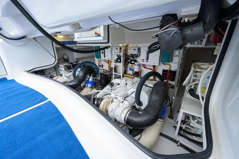 Slide: The Image of Engine room of 2013 Viking 42 Open yacht, showcasing mechanical components and systems. - 24