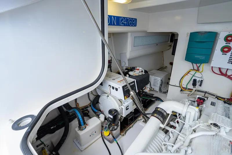 Slide: The Image of Engine room of 2013 Viking 42 Open yacht, showcasing equipment and wiring. - 25