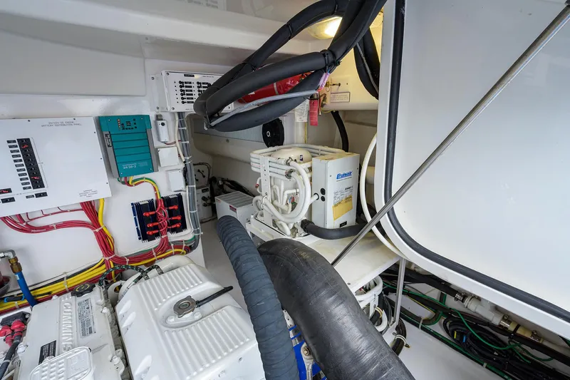 Slide: The Image of Engine room of 2013 Viking 42 Open yacht with electrical systems and components. - 27