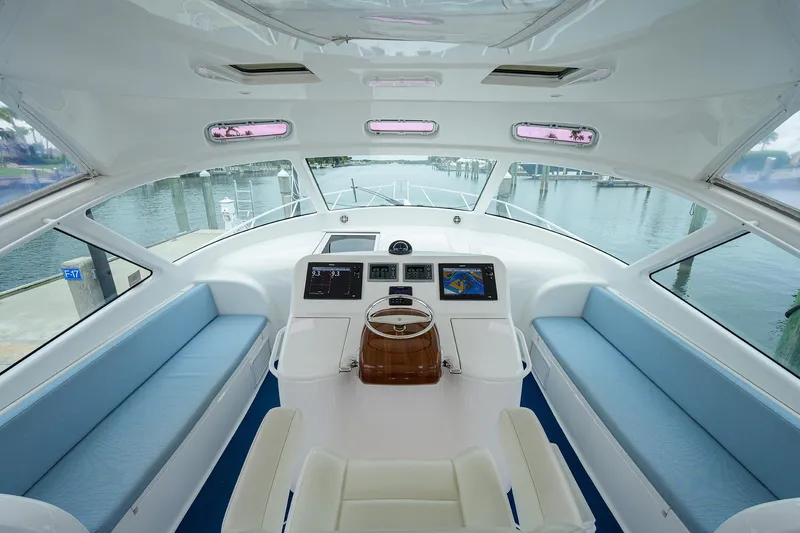 Slide: The Image of Interior of 2013 Viking 42 Open yacht with modern helm and seating. - 6