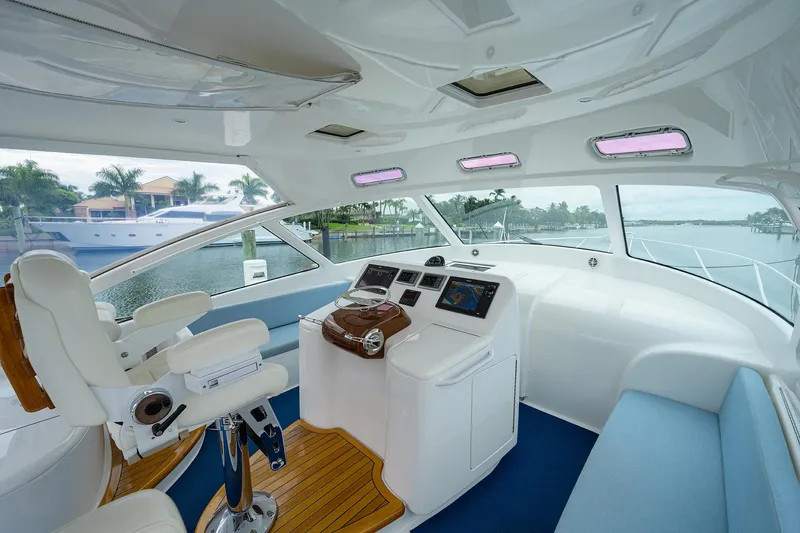 Slide: The Image of Interior of 2013 Viking 42 Open yacht with modern helm and seating. - 7
