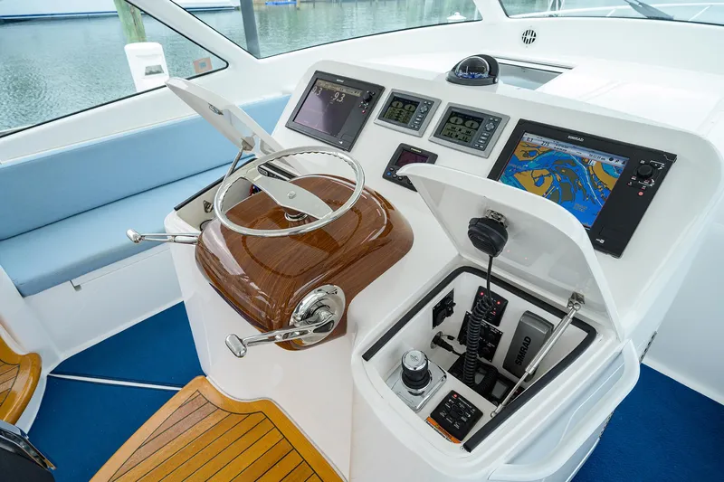 Slide: The Image of Helm of 2013 Viking 42 Open yacht with navigation screens and controls. - 8