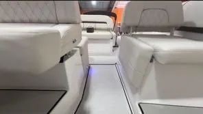 Slide: The Image of Luxurious interior of 2024 Regal 26 X boat with white seating and modern design. - 4