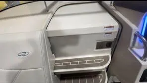 Slide: The Image of 2024 Regal 26 X boat interior with steps and storage compartment. - 5