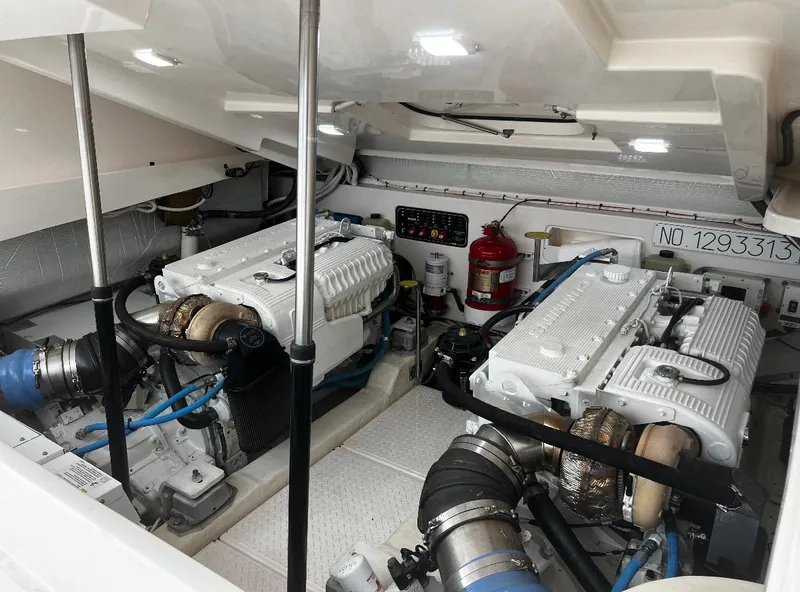 Slide: The Image of Engine room of 2019 Tiara Yachts 4300 Open, featuring dual engines and safety equipment. - 29