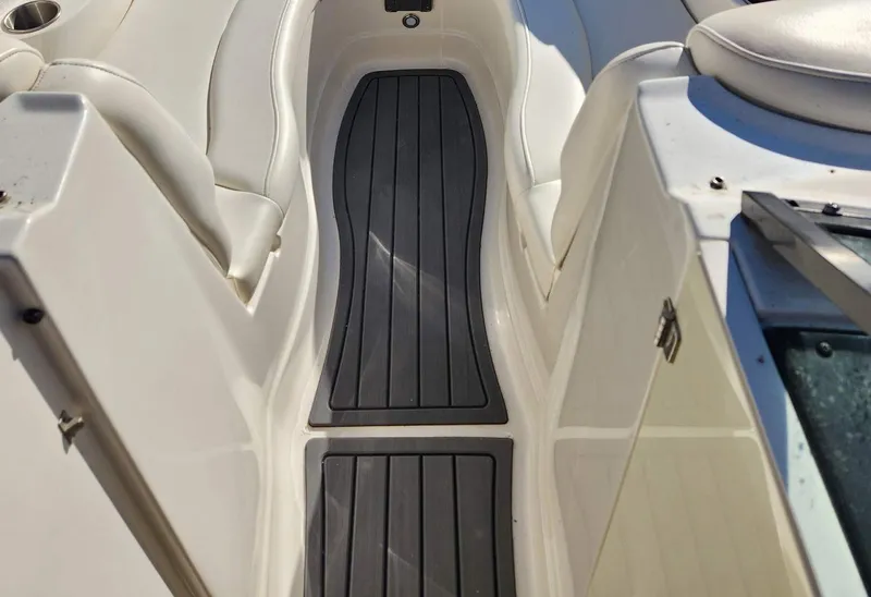 Slide: The Image of 2013 Monterey 264FSX boat interior with sleek seating and non-slip flooring. - 3