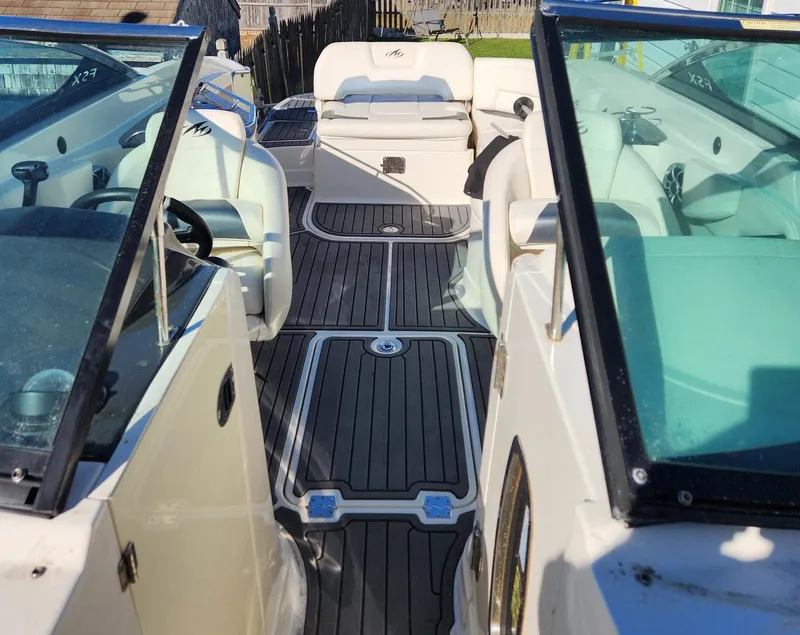 Slide: The Image of 2013 Monterey 264FSX boat interior with sleek seating and modern design. - 4