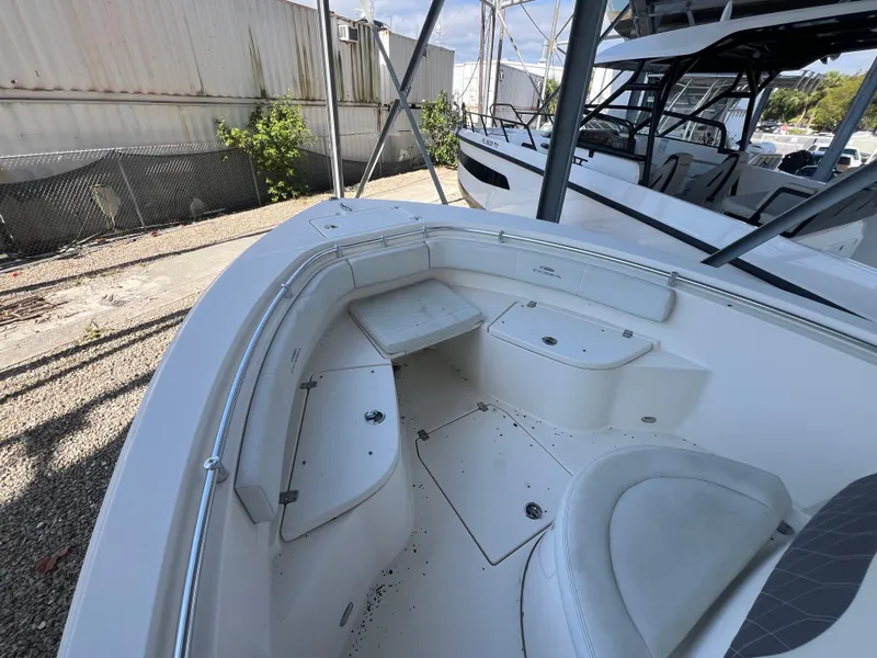 Slide: The Image of 2023 Cobia 237 Center Console boat interior with seating and storage compartments. - 14