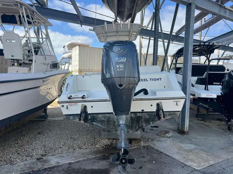 Slide: The Image of 2023 Cobia 237 Center Console boat with Yamaha 300 V6 engine in storage. - 7