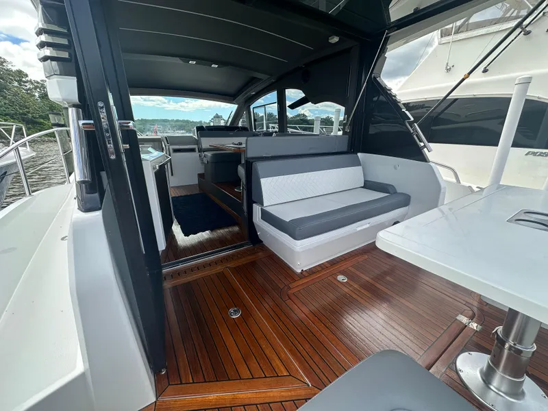 Slide: The Image of 2021 Galeon 425 HTS yacht interior with sleek seating and polished wood flooring. - 25