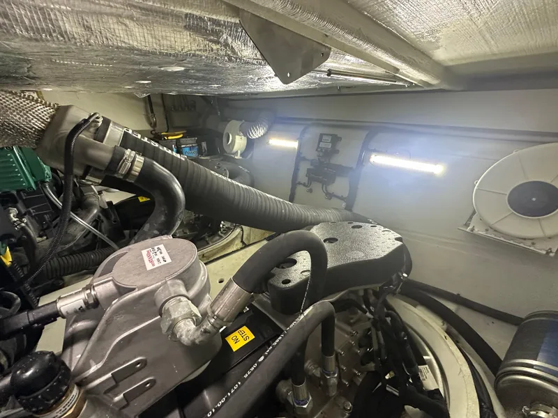Slide: The Image of Engine room of 2021 Galeon 425 HTS yacht, showcasing mechanical components and piping. - 29