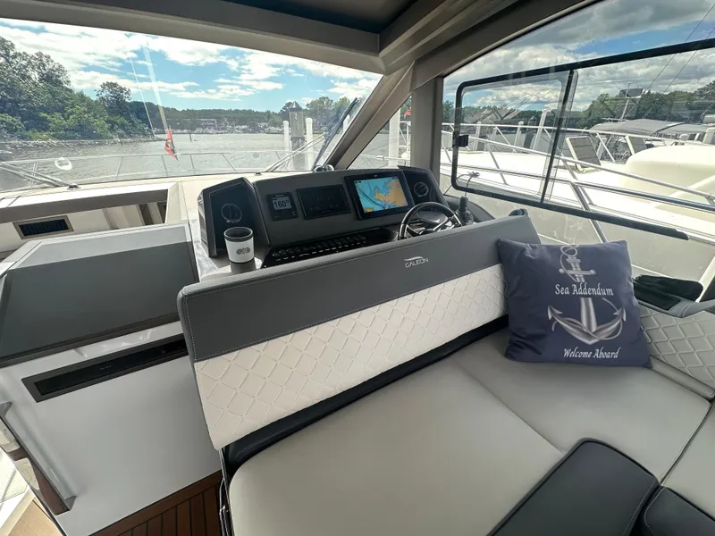 Slide: The Image of Interior of 2021 Galeon 425 HTS yacht with modern helm and nautical decor. - 35