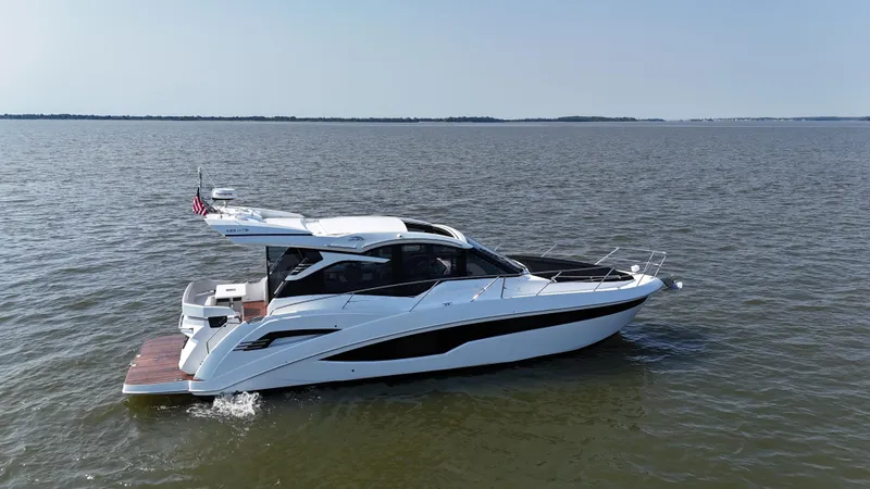 Slide: The Image of 2021 Galeon 425 HTS yacht cruising on open water. - 4
