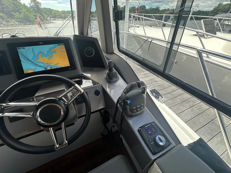Slide: The Image of Helm of 2021 Galeon 425 HTS yacht with navigation screen and controls. - 42