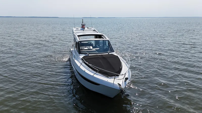 Slide: The Image of 2021 Galeon 425 HTS yacht cruising on open water. - 5