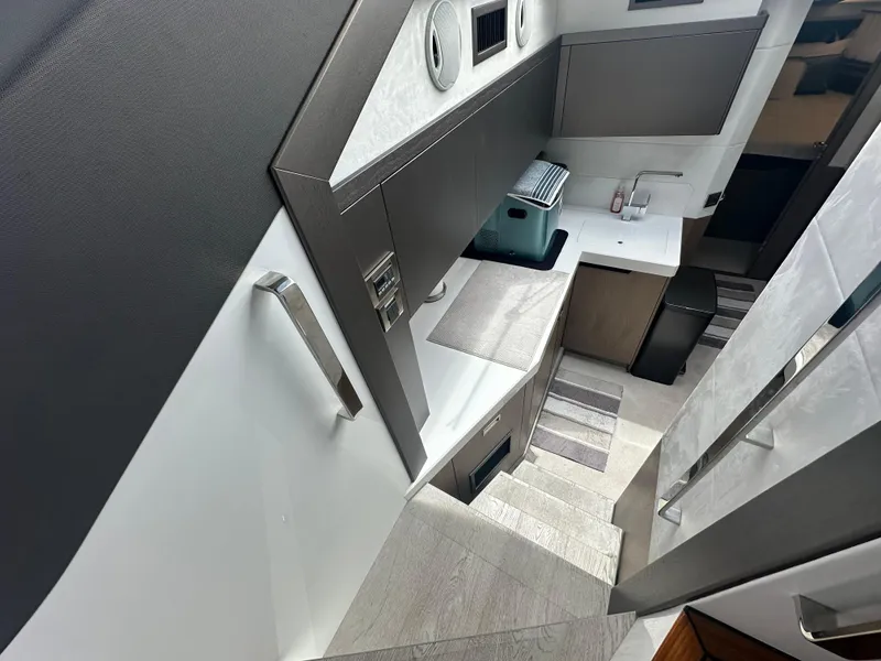 Slide: The Image of Interior of 2021 Galeon 425 HTS yacht, featuring modern kitchen design and sleek cabinetry. - 54