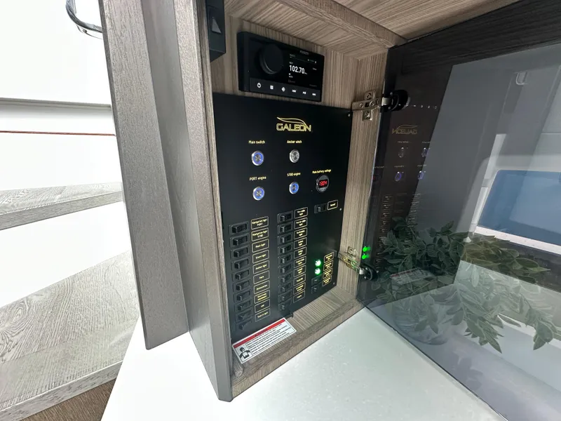 Slide: The Image of Electrical control panel inside 2021 Galeon 425 HTS yacht, featuring switches and display. - 55