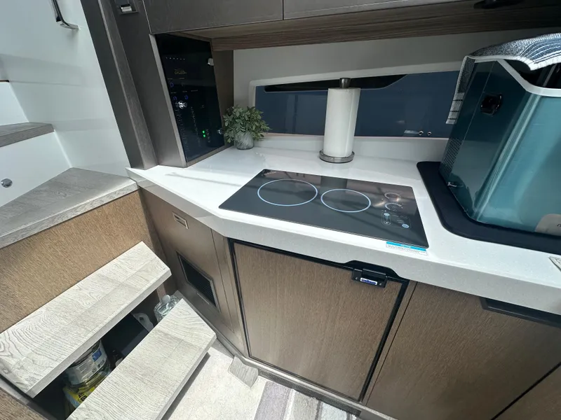 Slide: The Image of Modern kitchen area in a 2021 Galeon 425 HTS yacht with induction cooktop. - 58