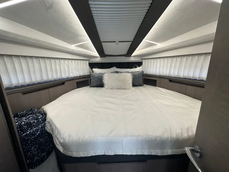 Slide: The Image of Luxurious bedroom interior of 2021 Galeon 425 HTS yacht with elegant bedding and modern design. - 60