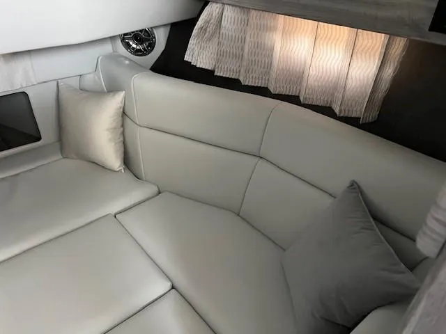 Slide: The Image of 2025 Formula 330 Crossover Bowrider I/O interior with plush seating and elegant design. - 8