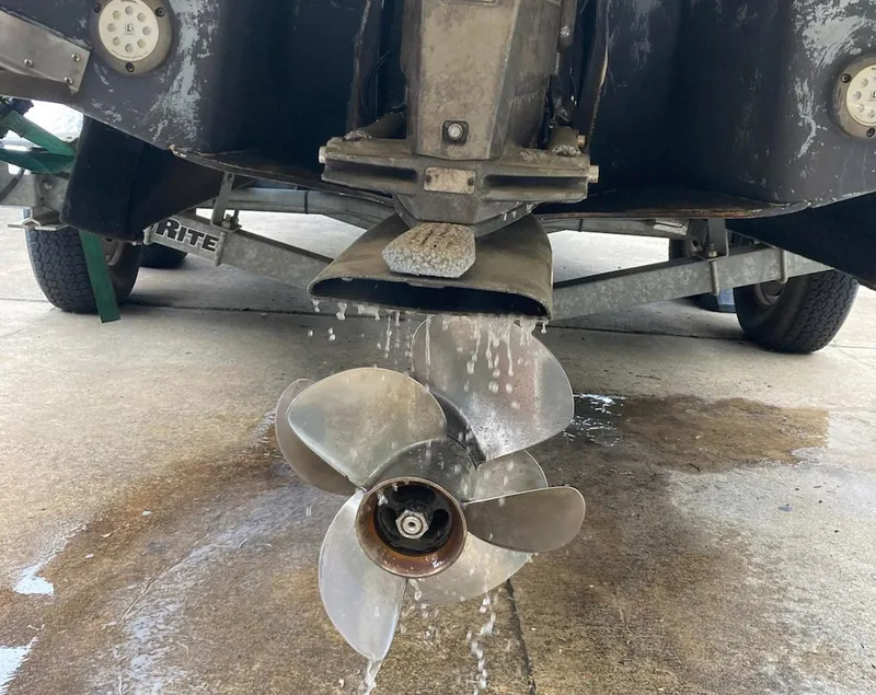 Slide: The Image of 2015 Regal 28 Express boat propeller with water draining on a trailer. - 17