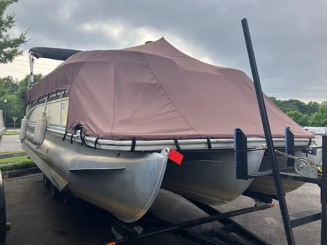 Slide: The Image of 2007 Bennington 2275QXi pontoon boat with brown cover on trailer. - 1