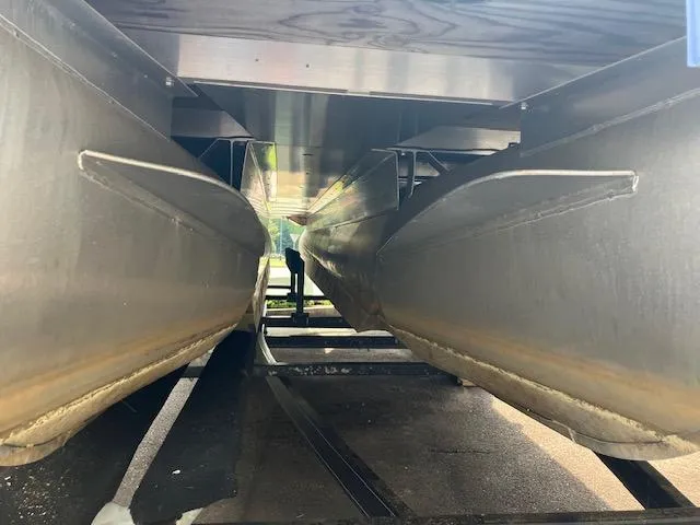 Slide: The Image of Underneath view of a 2007 Bennington 2275QXi pontoon boat, showcasing dual pontoons. - 11