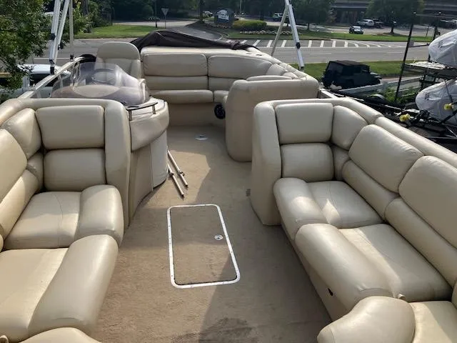 Slide: The Image of 2007 Bennington 2275QXi pontoon boat with beige leather seating and spacious deck layout. - 6