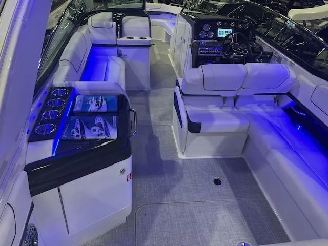 Slide: The Image of 2025 Formula 310 Bowrider I/O interior with blue LED lighting and luxurious seating. - 12