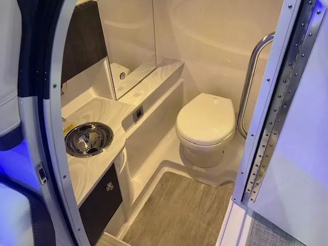 Slide: The Image of Interior of 2025 Formula 310 Bowrider I/O boat bathroom with modern fixtures. - 16