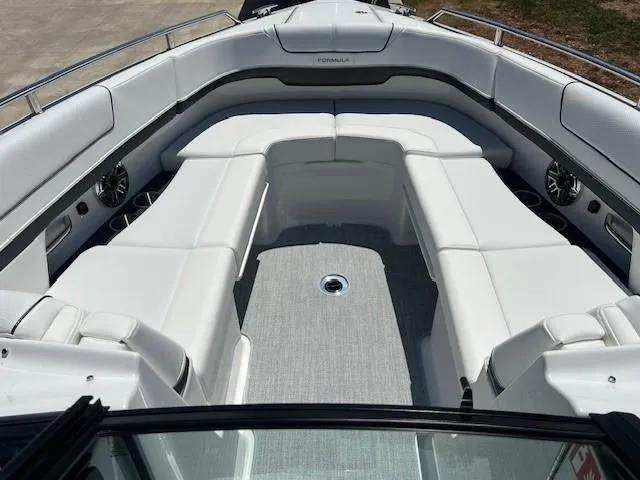 Slide: The Image of 2025 Formula 310 Bowrider I/O boat with spacious white seating and modern design. - 8