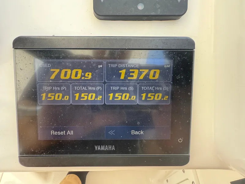 Slide: The Image of Yamaha display showing fuel usage and trip data on 2022 Edgewater 262 CX boat. - 27