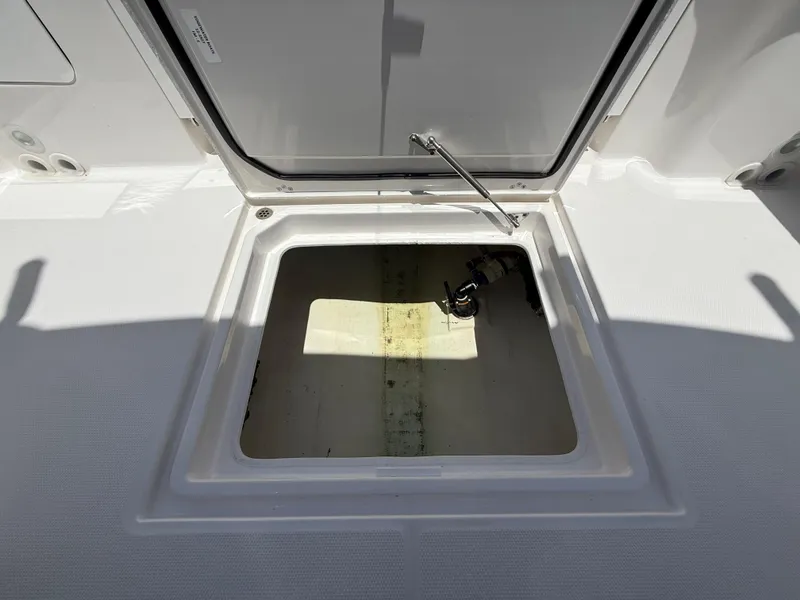 Slide: The Image of Open storage compartment on 2022 Edgewater 262 CX boat deck. - 39